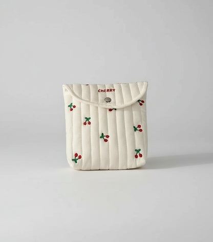 Product information card with a white pouch featuring cherry designs on a white background.